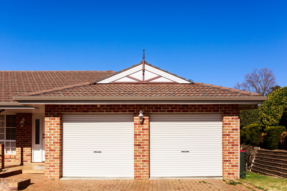 brown and white concrete house under blue sky during daytime