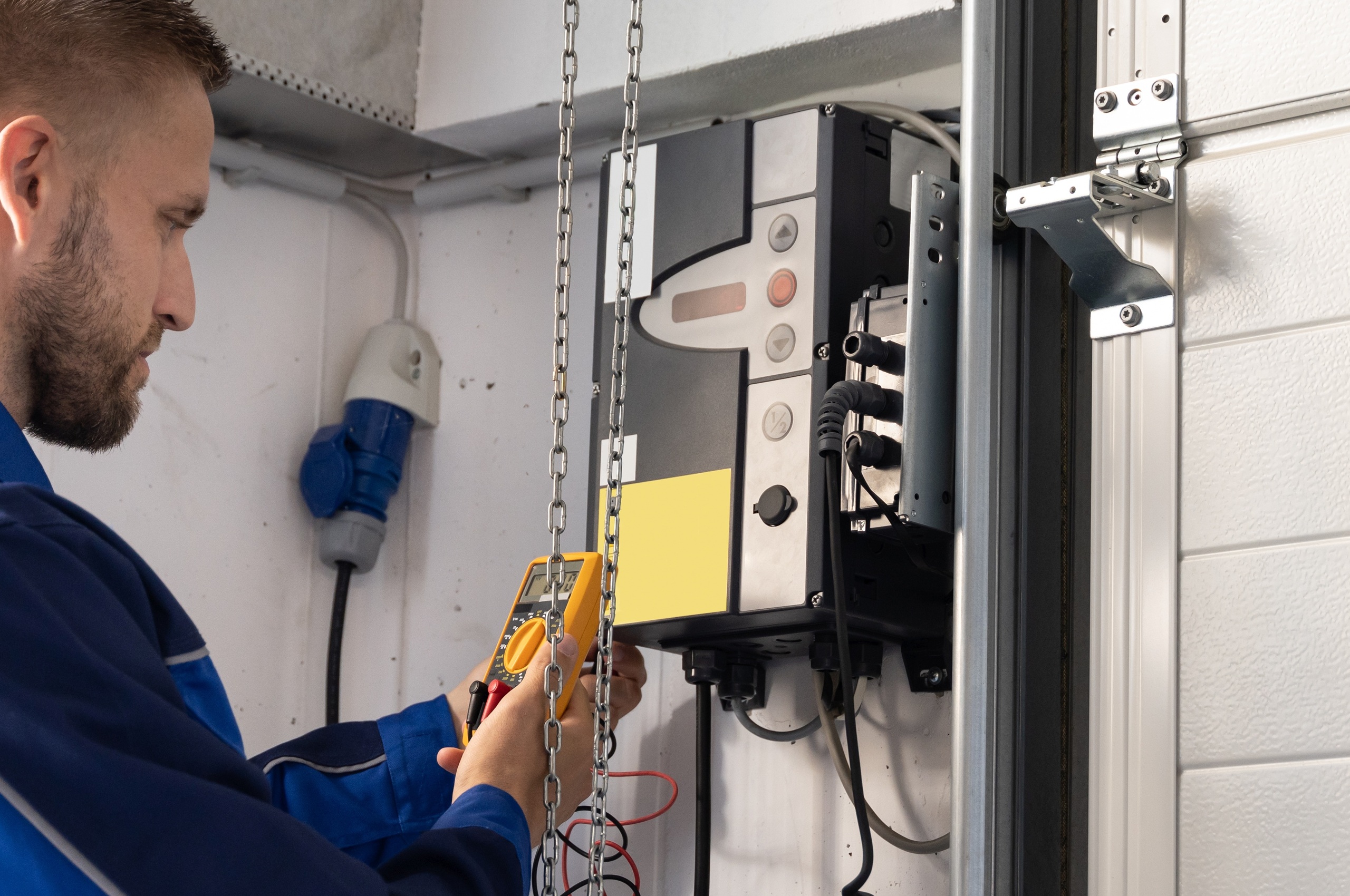 white and brown wooden house near green trees under blue sky during daytime