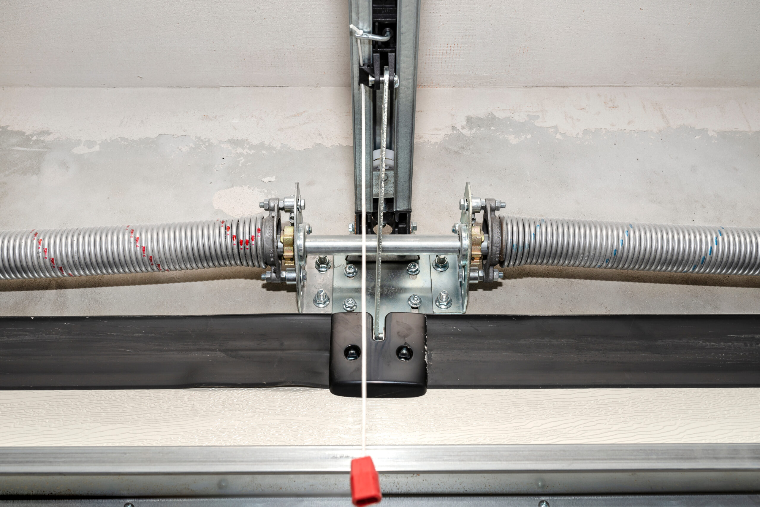 white and brown wooden house near green trees under blue sky during daytime